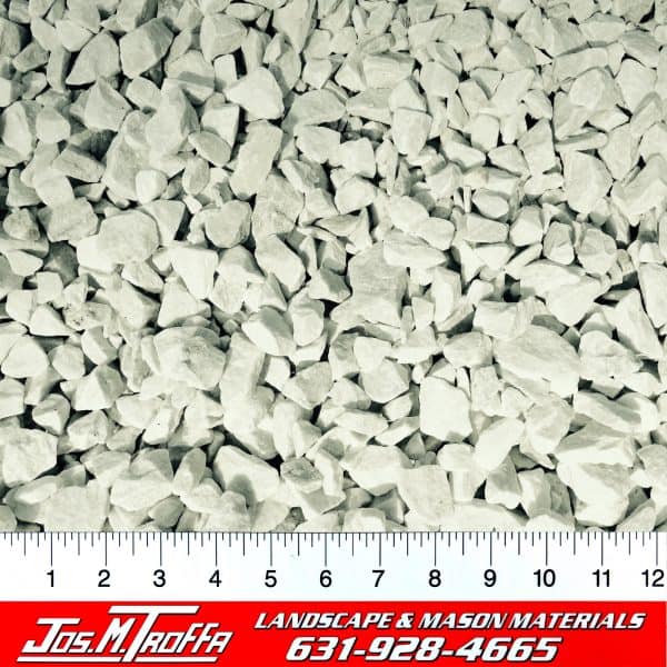 White gravel stones displayed with a ruler for scale, alongside contact information for JOS. M. TROFFA Landscape & Mason Materials in Long Island, NY.