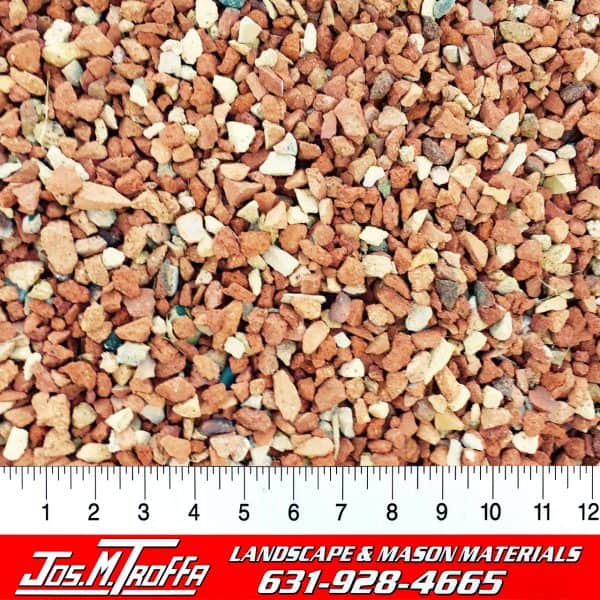 Reddish-brown and white gravel stones shown with a ruler for scale, from JOS. M. TROFFA Landscape & Mason Materials in Long Island, NY.