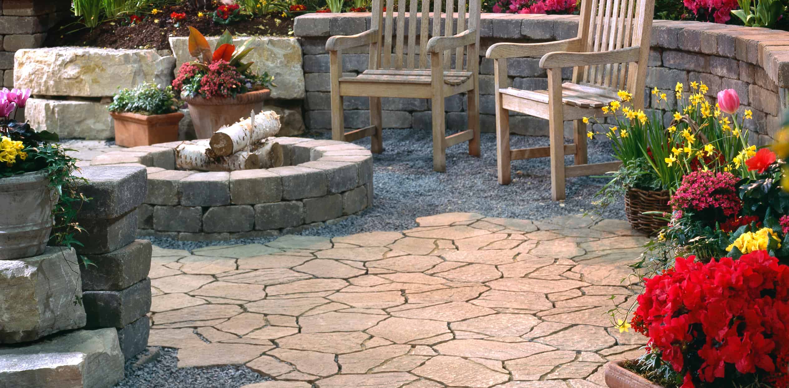 Brick Fireplace with wooden chairs with flowers